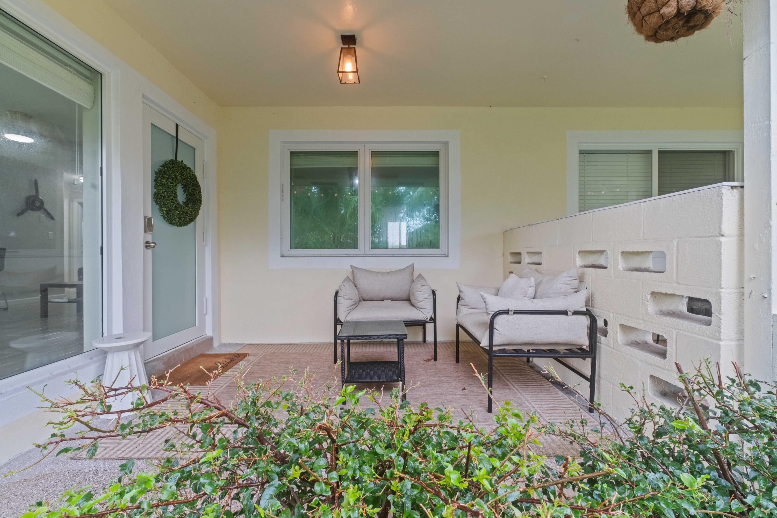1007 Northeast 9th Court Pompano Beach, FL 33060 - Photo 18 of 21 a living room with furniture and a potted plant