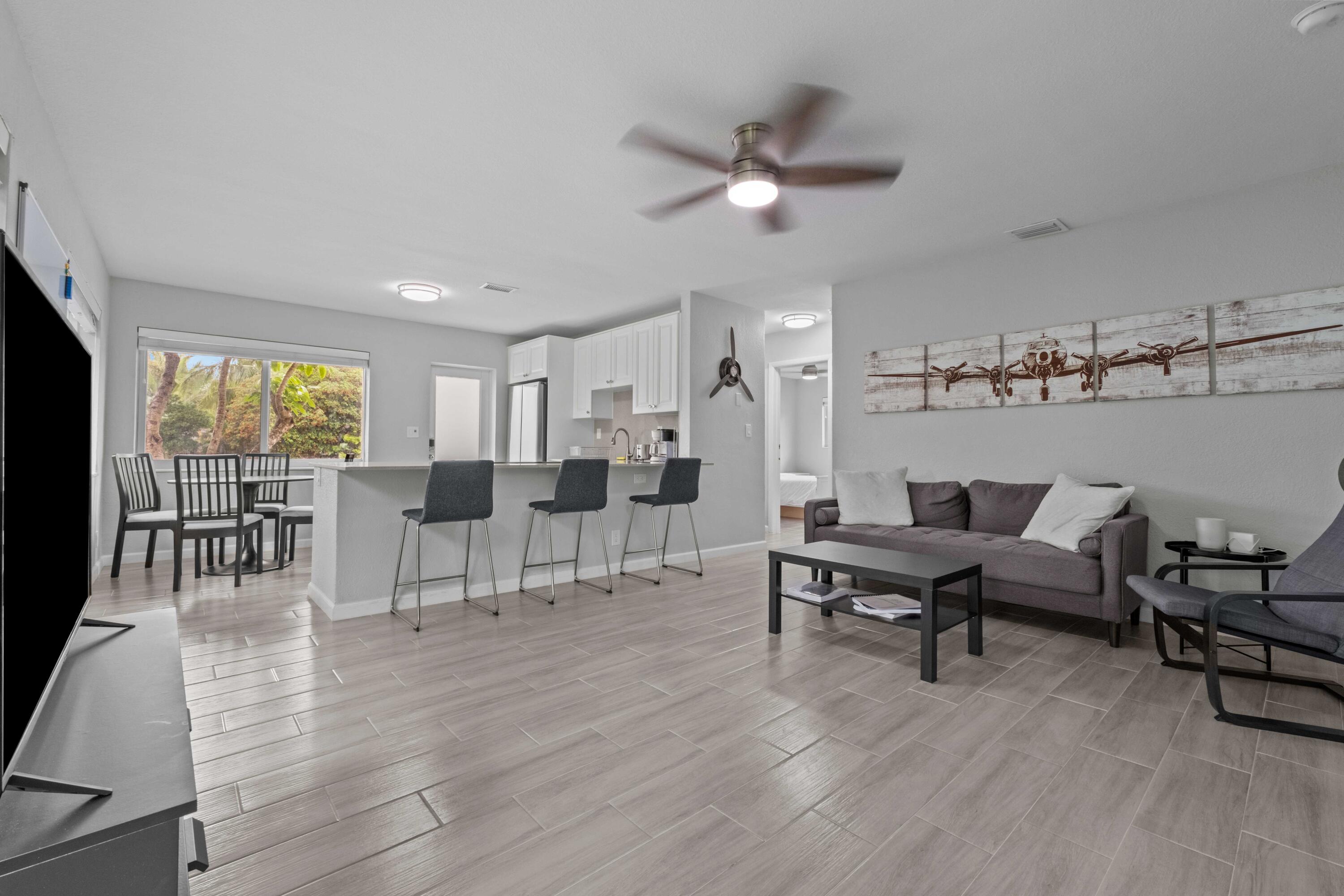 1007 Northeast 9th Court Pompano Beach, FL 33060 - Photo 4 of 21 a living room with furniture and view of kitchen