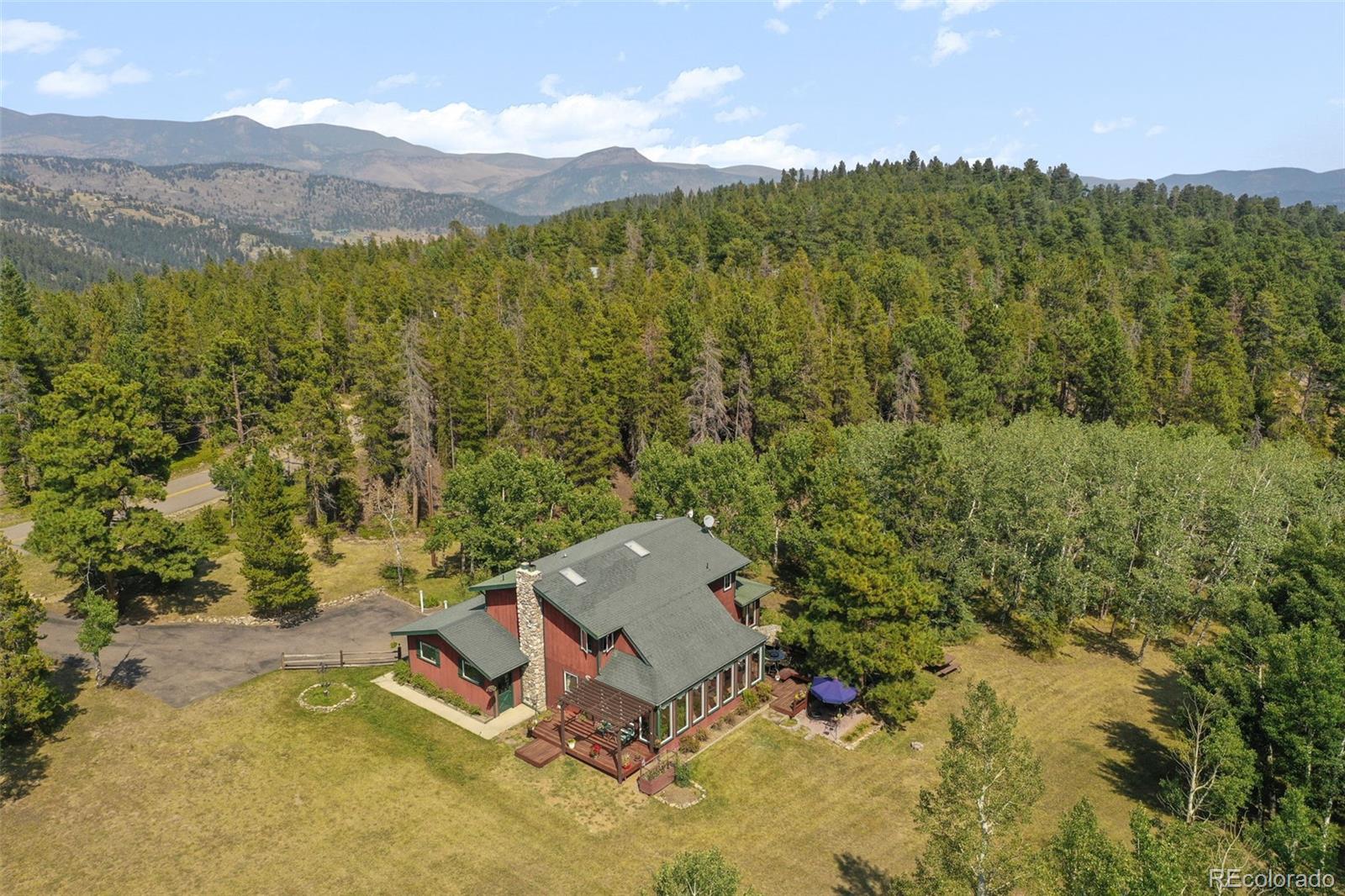 an aerial view of a house with a yard