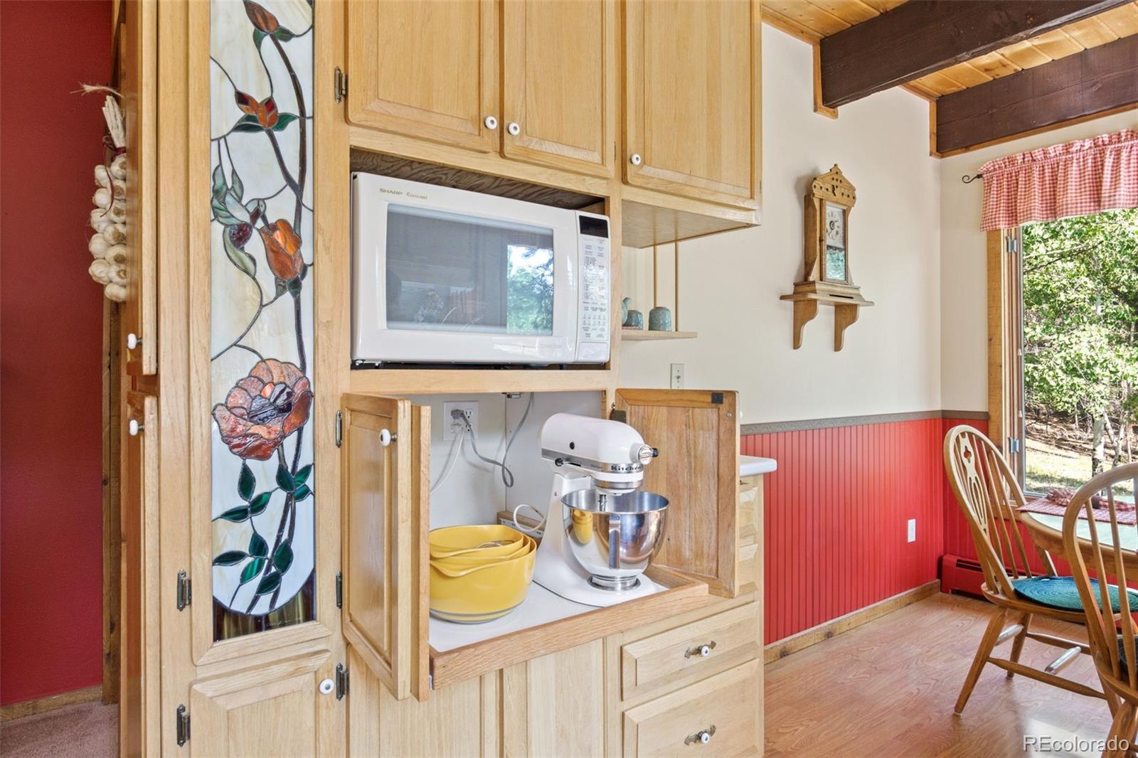 600 Old Squaw Pass Road Evergreen, CO 80439 - Photo 15 of 40 a view of a entryway with furniture and chandelier