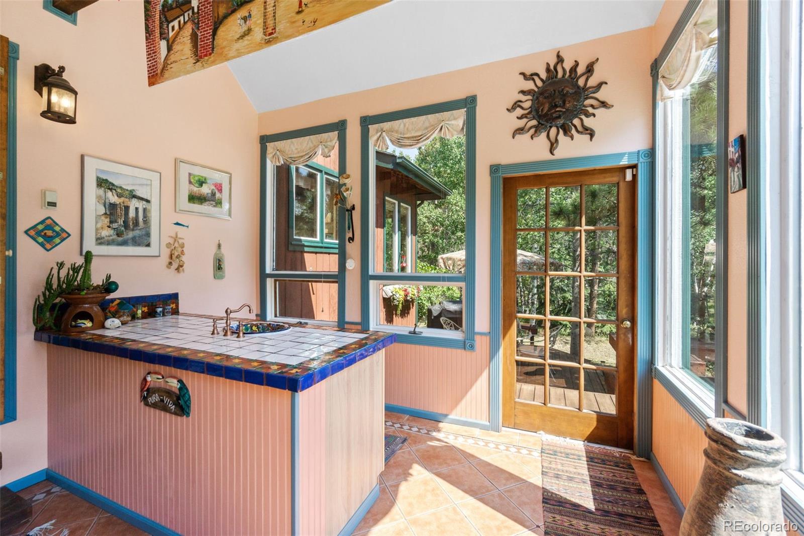 600 Old Squaw Pass Road Evergreen, CO 80439 - Photo 20 of 40 a dining room with a window