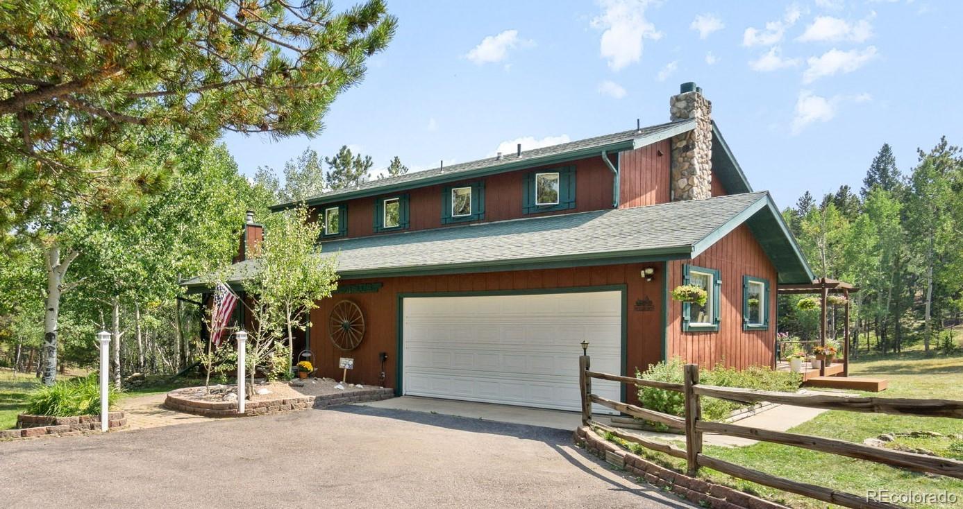 600 Old Squaw Pass Road Evergreen, CO 80439 - Photo 40 of 40 a house with garden