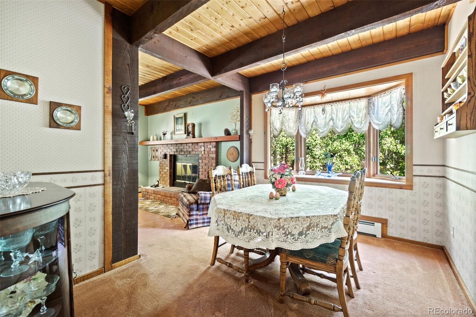 600 Old Squaw Pass Road Evergreen, CO 80439 - Photo 7 of 40 a dining room with furniture and window