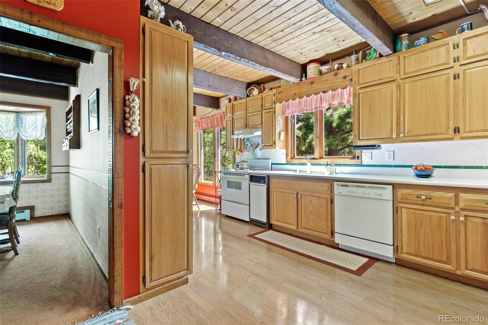600 Old Squaw Pass Road Evergreen, CO 80439 - Photo 9 of 40 a kitchen with stainless steel appliances granite countertop a stove a sink and a refrigerator