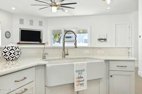 a bathroom with a double vanity sink mirror and shower