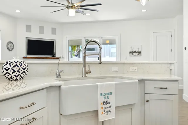 a bathroom with a double vanity sink mirror and shower
