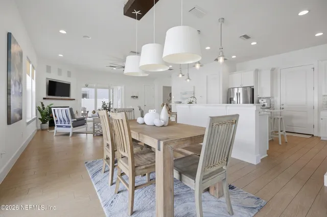 an aerial view of a house with a garden and lake view