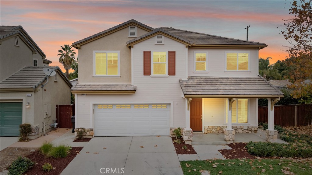 4003 Garvey Way Riverside, CA 92501 - Photo 1 of 1 a front view of a house with a yard