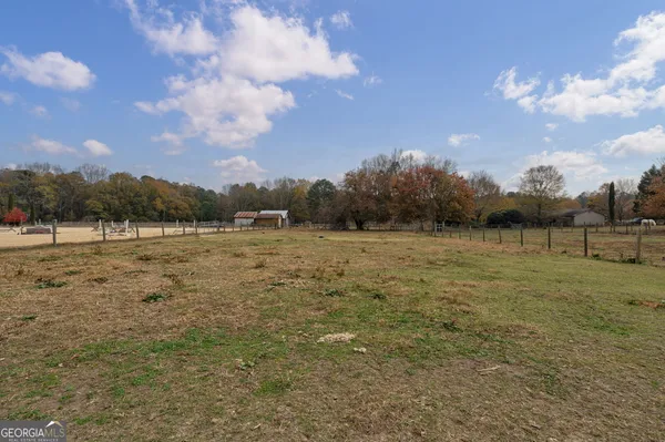 a view of a lake with houses in the back