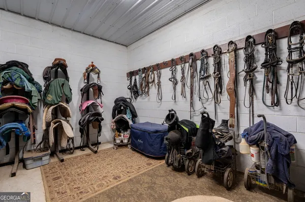 a view of a chairs and table in the back yard of the building