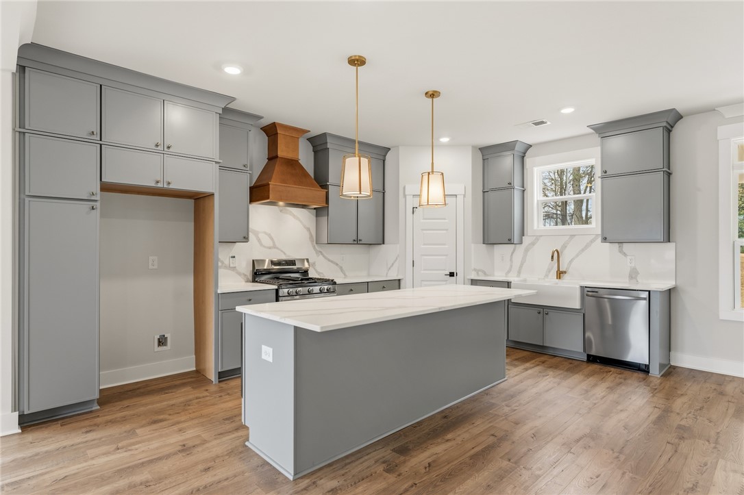 319 Summerall Drive Anderson, SC 29621 - Photo 8 of 37 This newly renovated kitchen features a spacious island and modern appliances, perfect for culinary endeavors.