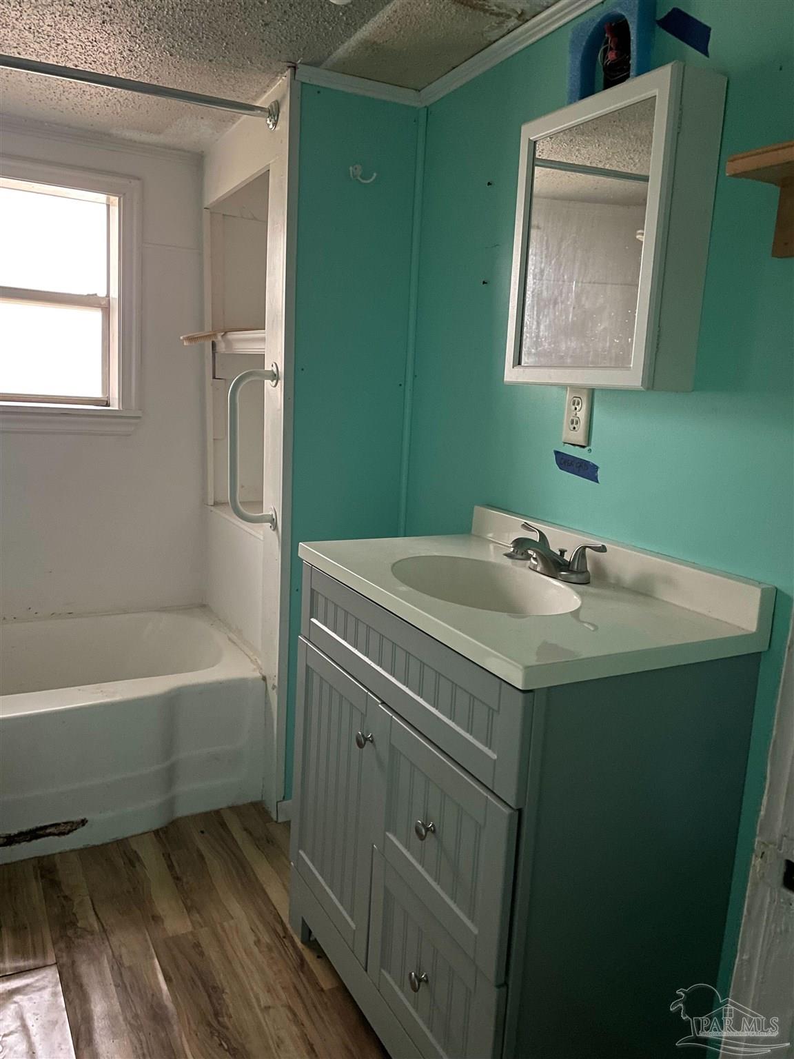451 East Cane Avenue Crestview, FL 32539 - Photo 11 of 22 a bathroom with a sink and a mirror