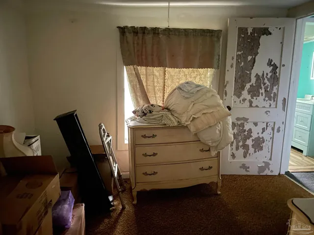 a view of bedroom with a bed