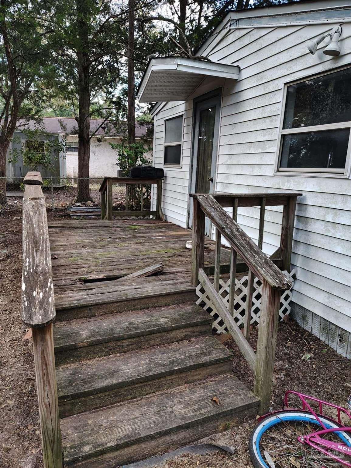 451 East Cane Avenue Crestview, FL 32539 - Photo 19 of 22 a view of street along with trees