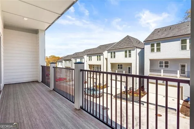 a view of a houses from a balcony