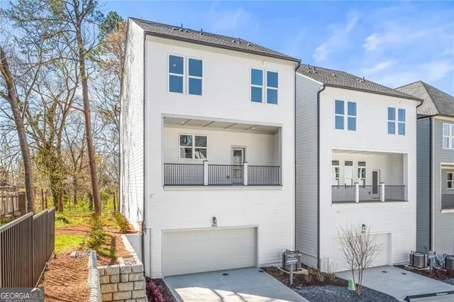 a view of tall building with a street