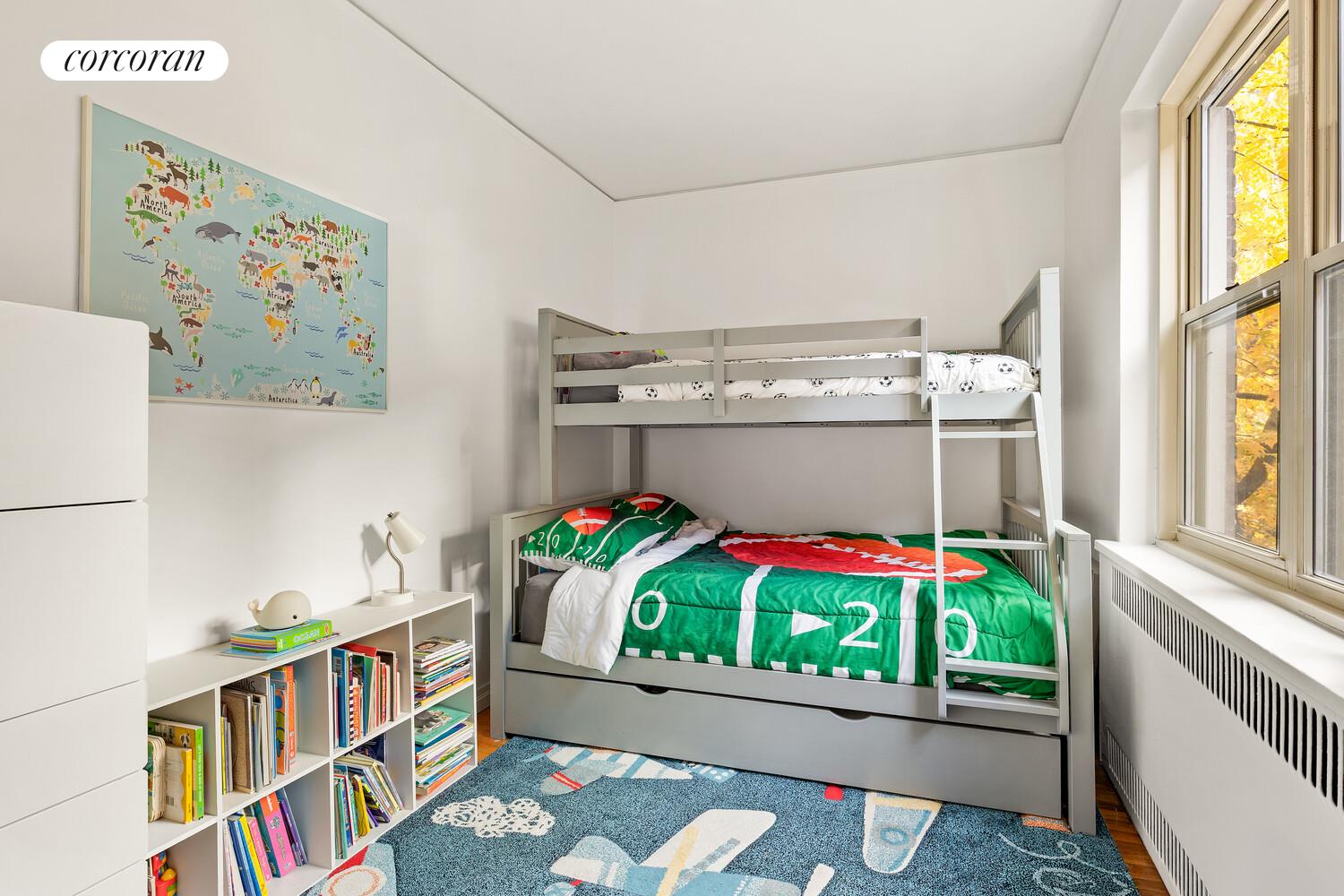 530 East 90th Street, Unit 5H Manhattan, NY 10128 - Photo 6 of 15 a living room with furniture and a table