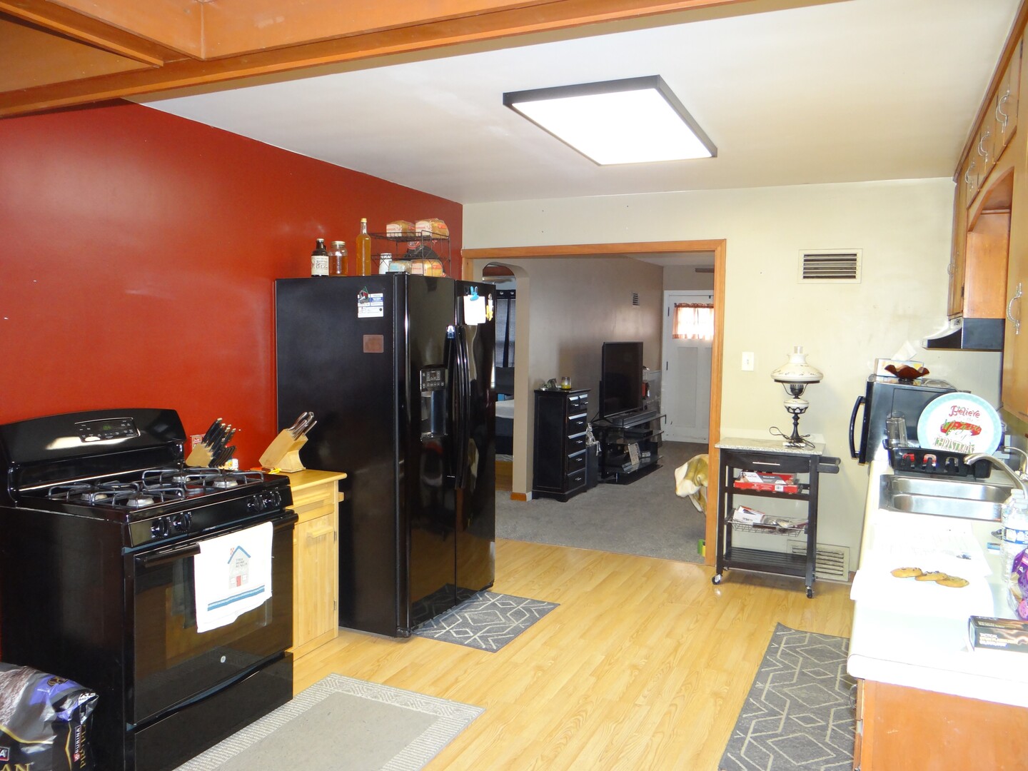 831 Douglas Street Morris, IL 60450 - Photo 3 of 18 a kitchen with a refrigerator and a stove