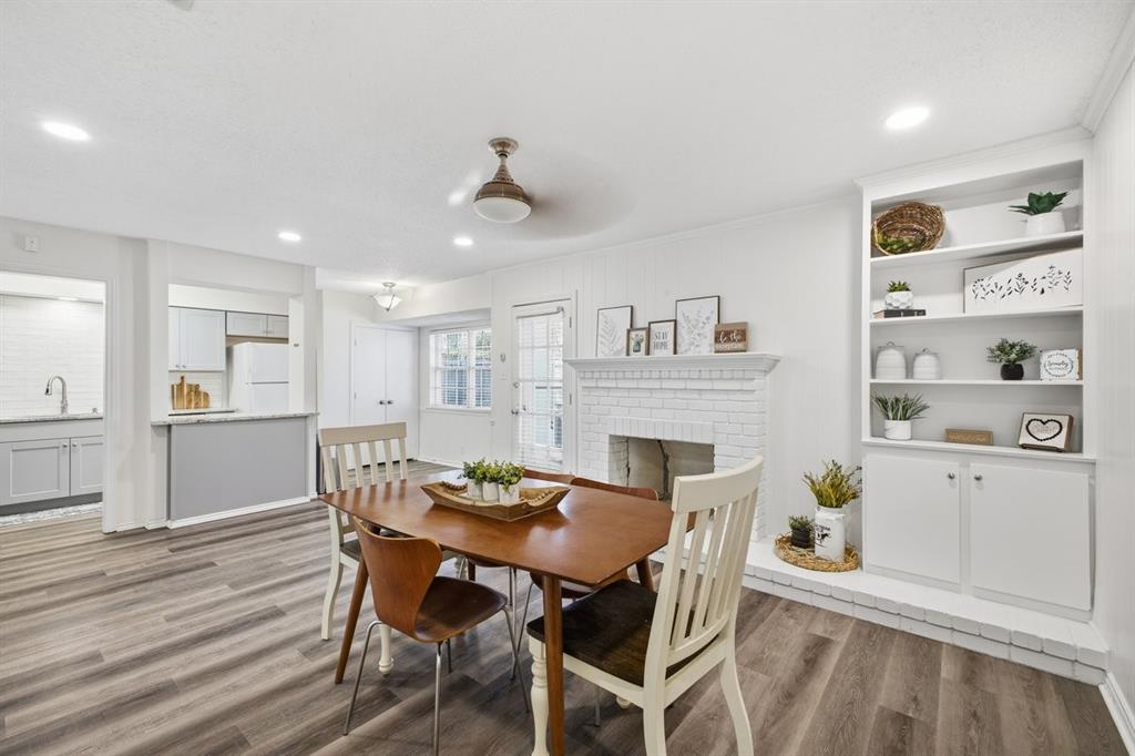 907 Roaring Springs Road Fort Worth, TX 76114 - Photo 14 of 27 a view of a dining room with furniture and wooden floor