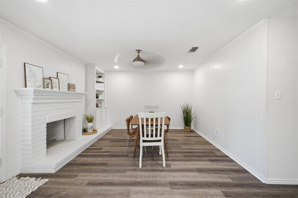 907 Roaring Springs Road Fort Worth, TX 76114 - Photo 15 of 27 a living room with furniture and a fireplace