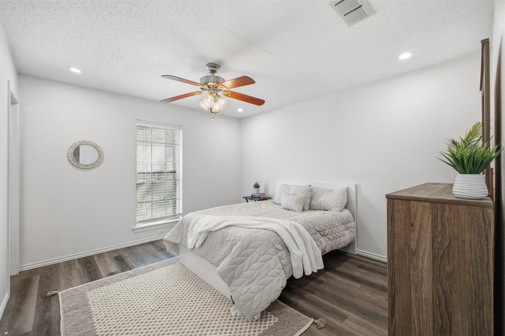 907 Roaring Springs Road Fort Worth, TX 76114 - Photo 19 of 27 a bedroom with a large bed and a window