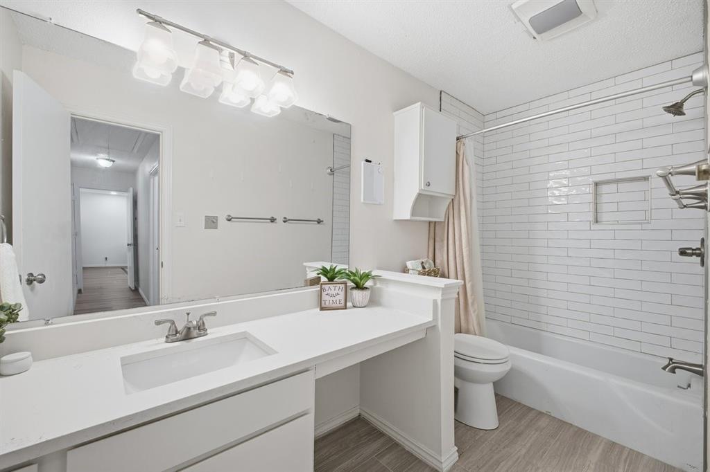 907 Roaring Springs Road Fort Worth, TX 76114 - Photo 21 of 27 a bathroom with a sink toilet and shower