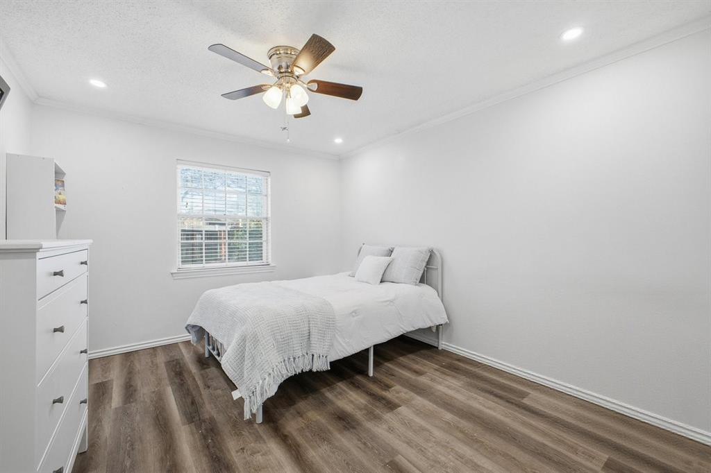 907 Roaring Springs Road Fort Worth, TX 76114 - Photo 22 of 27 a bedroom with a bed and a window