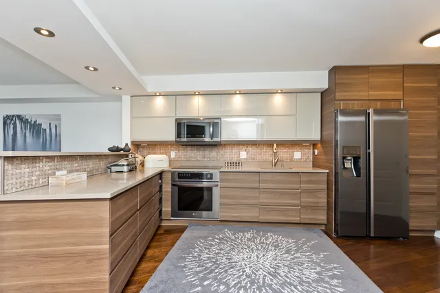 a kitchen with a stove and a refrigerator