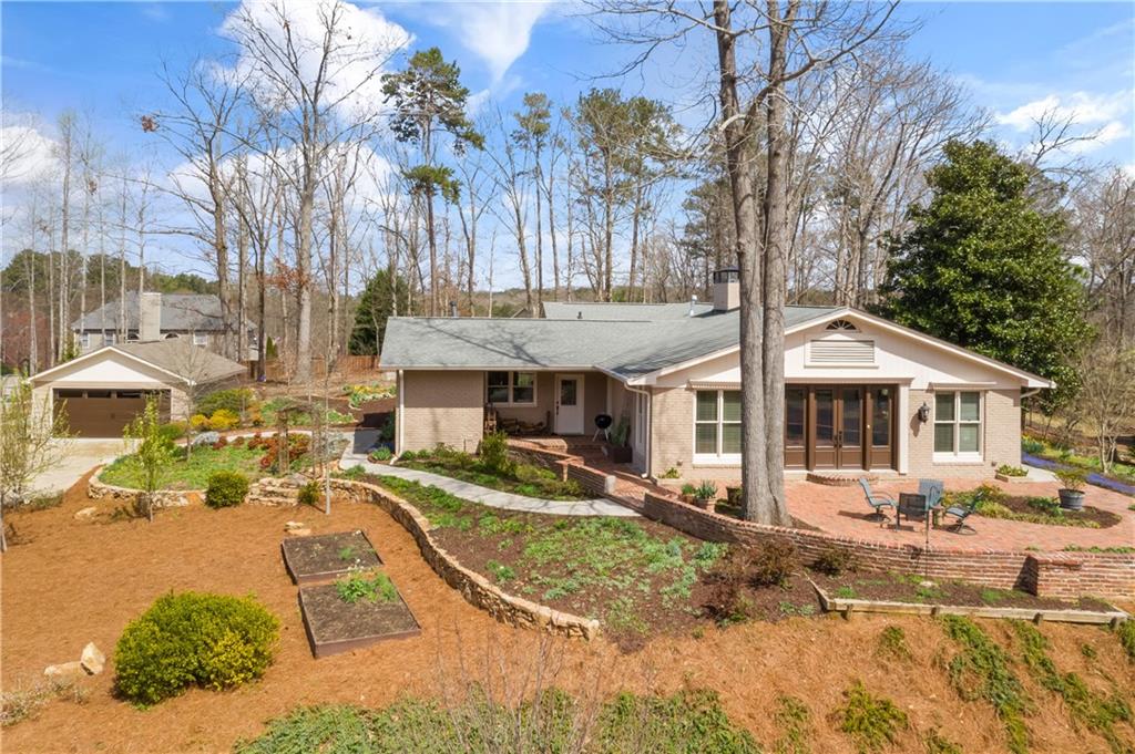 1040 Honor Run Alpharetta, GA 30005 - Photo 1 of 1 a front view of a house with a yard covered with snow in front of house