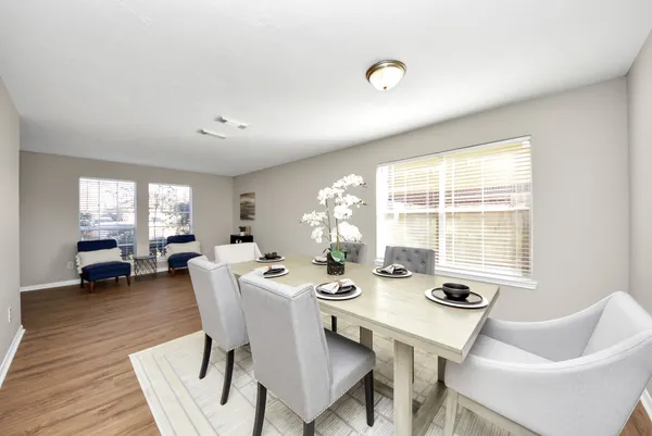 a view of a dining room with furniture window and outside view