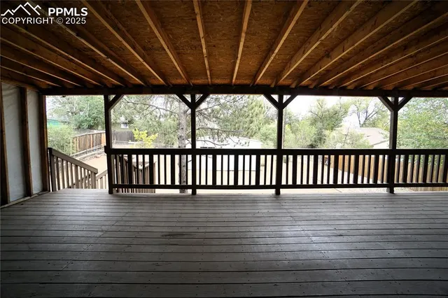 a view of porch with wooden floor