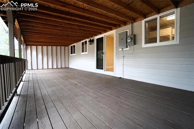 a view of outdoor space with wooden floor