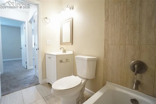 a bathroom with a shower and a bath tub
