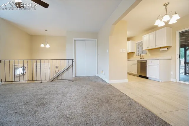 a view of a kitchen with a sink cabinets and a window