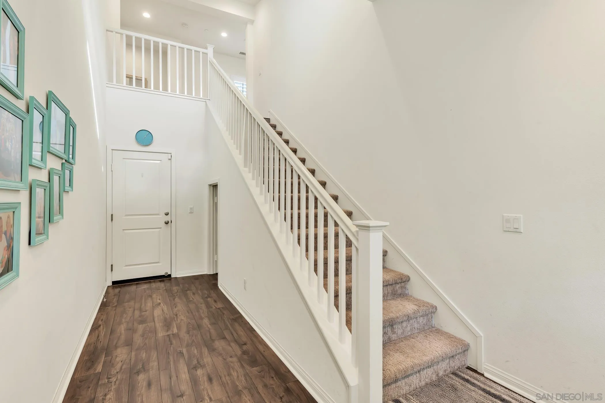 4307 Star Path Way, Unit 1 Oceanside, CA 92056 - Photo 11 of 34 a view of a hallway with wooden floor and staircase