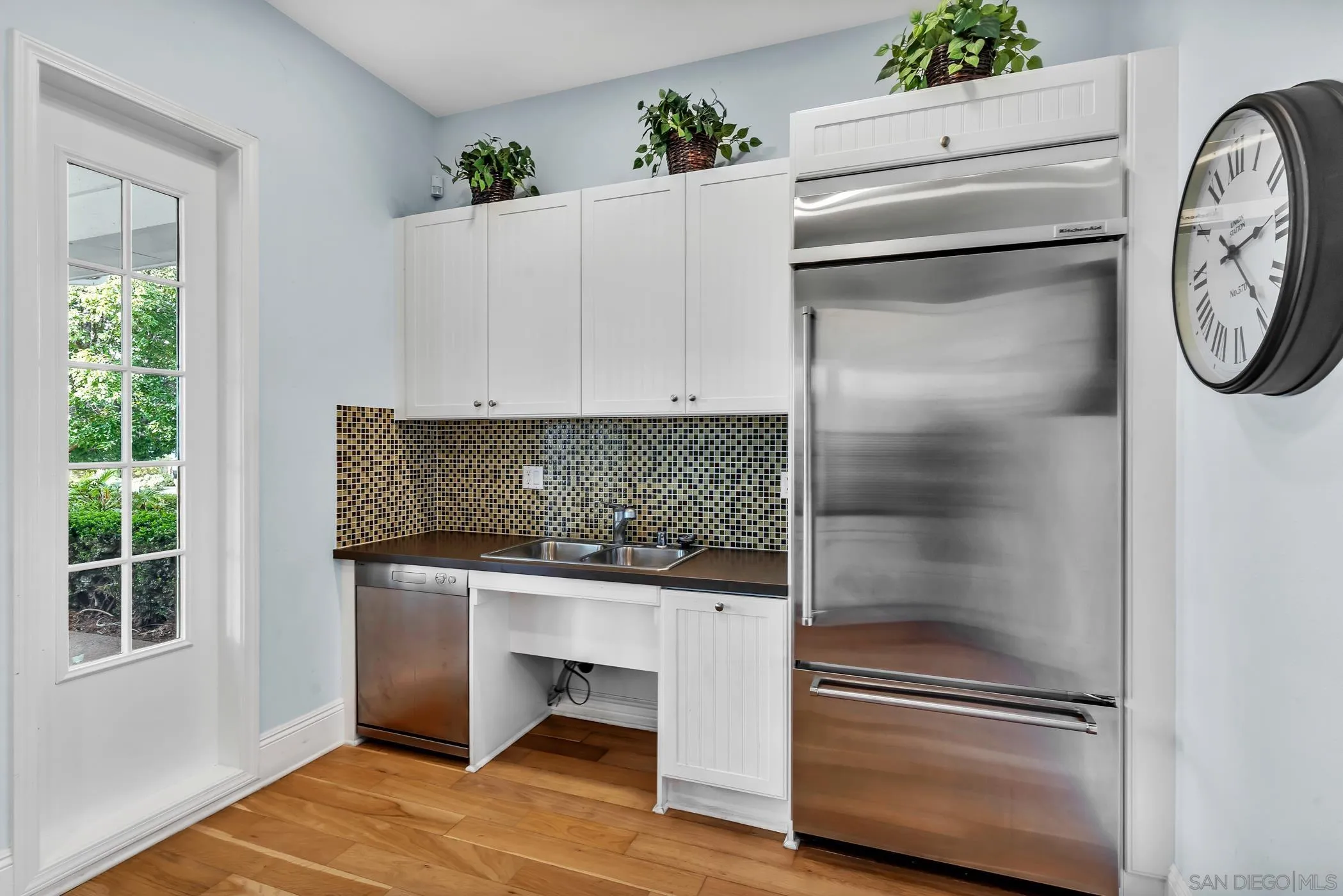 4307 Star Path Way, Unit 1 Oceanside, CA 92056 - Photo 28 of 34 a kitchen with a refrigerator and a window