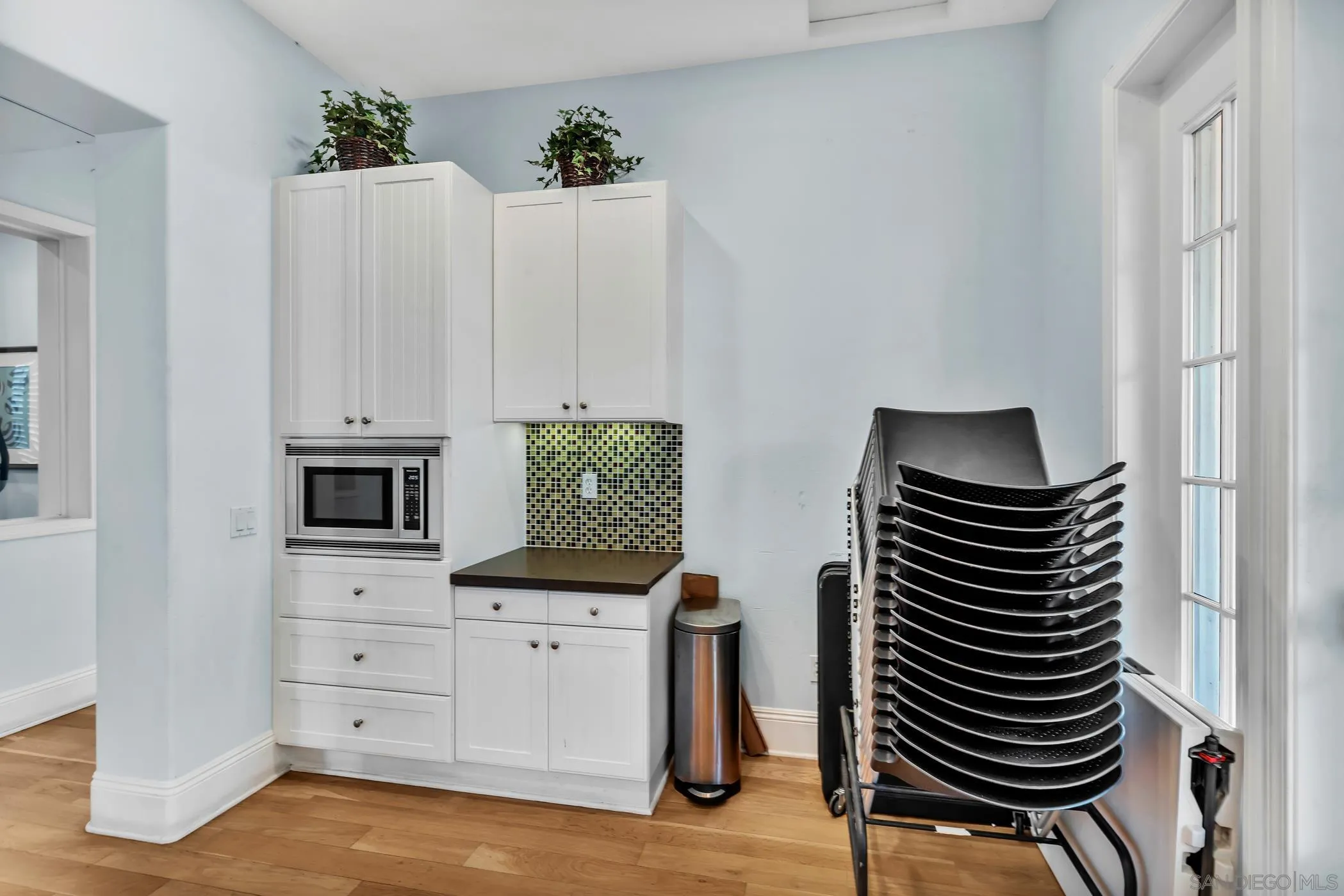 4307 Star Path Way, Unit 1 Oceanside, CA 92056 - Photo 29 of 34 a kitchen with white cabinets and appliances