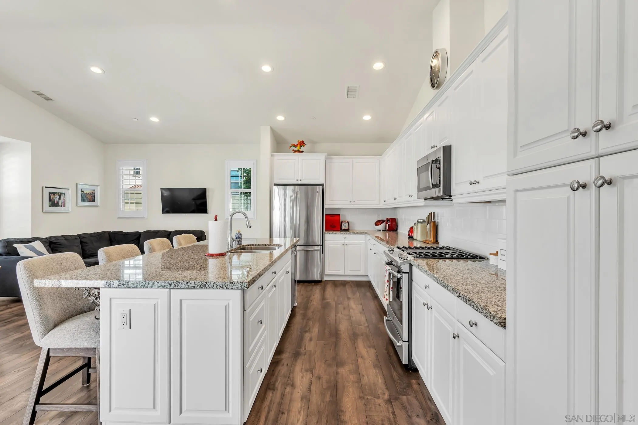 4307 Star Path Way, Unit 1 Oceanside, CA 92056 - Photo 3 of 34 a kitchen with stainless steel appliances granite countertop a refrigerator sink and cabinets
