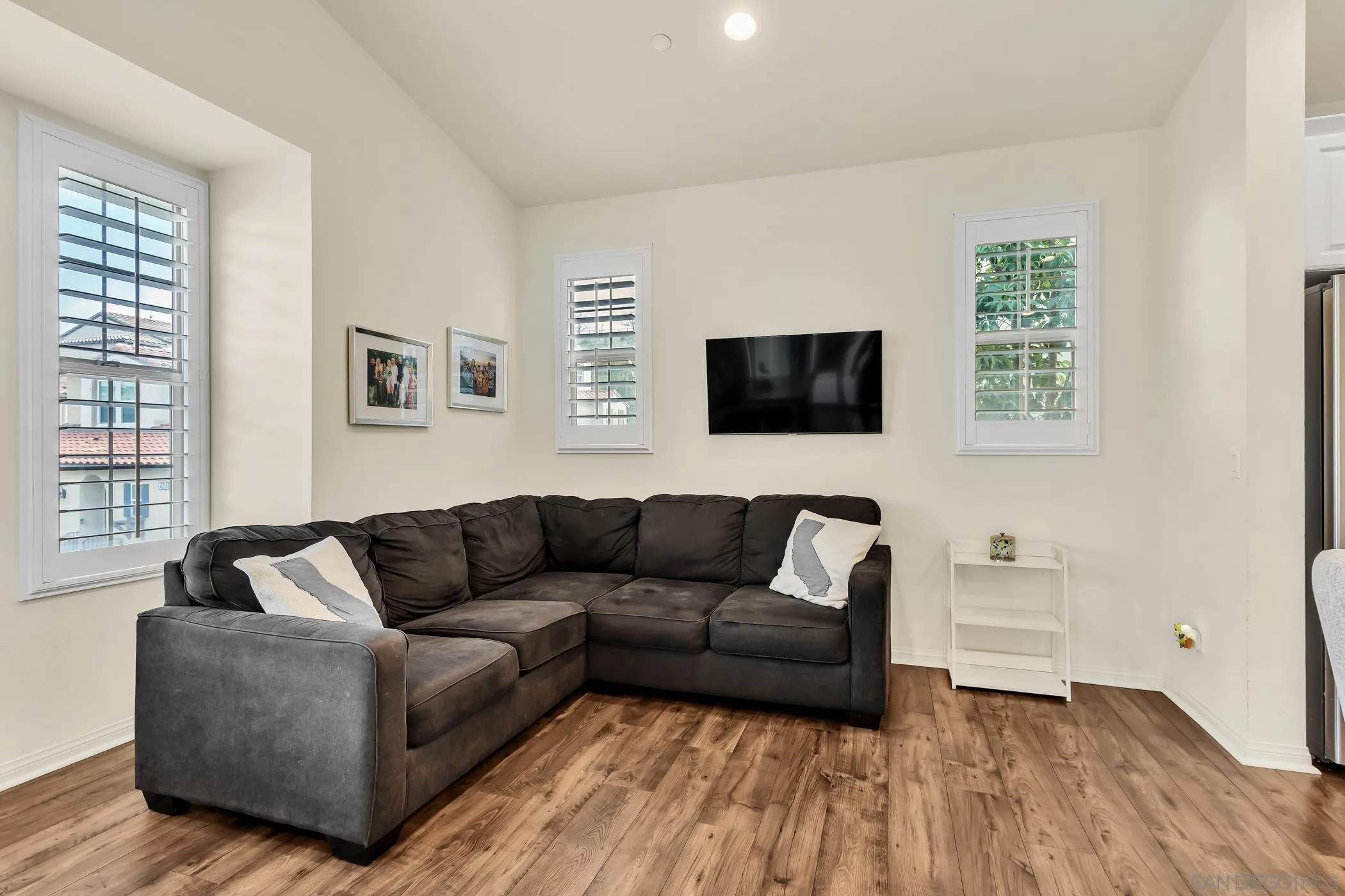 4307 Star Path Way, Unit 1 Oceanside, CA 92056 - Photo 9 of 34 a living room with furniture and a flat screen tv