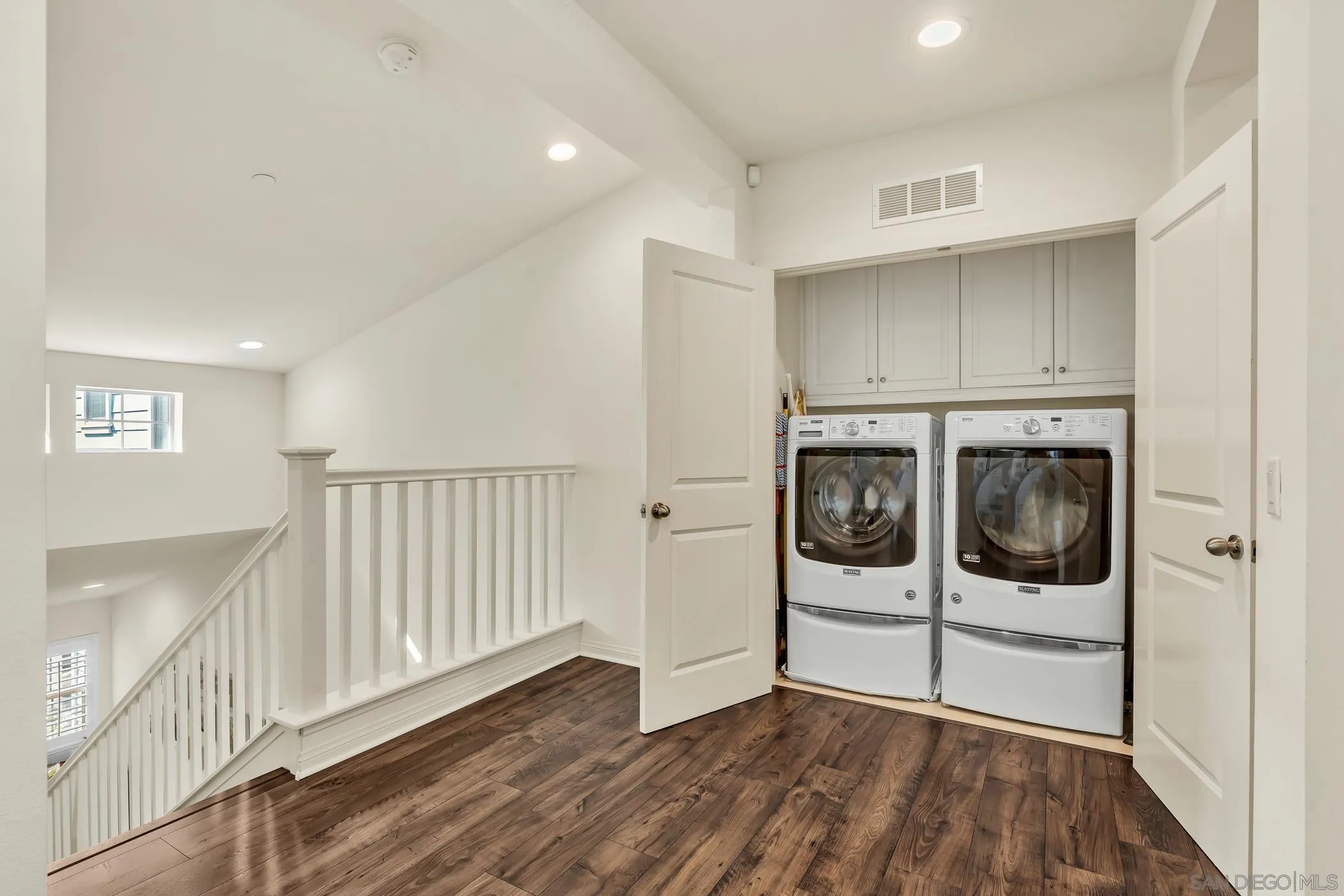 4307 Star Path Way, Unit 1 Oceanside, CA 92056 - Photo 10 of 34 a view of a hallway with wooden floor and staircase