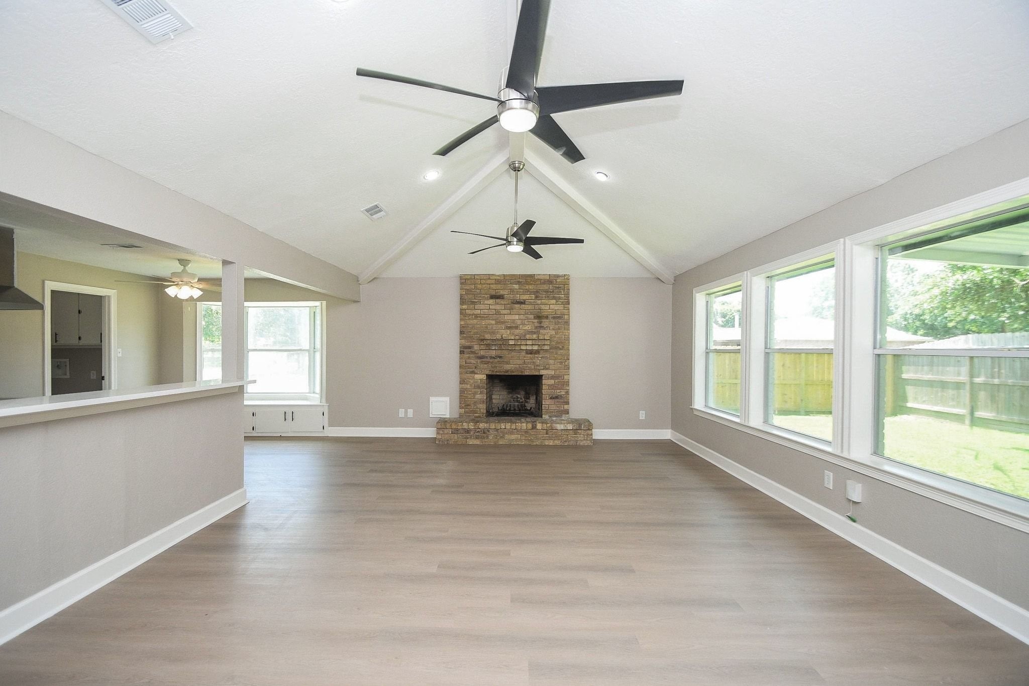 29003 Raestone Street Spring, TX 77386 - Photo 6 of 21 High ceiling in living room with beam accents!