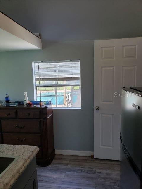 20805 Sheldon Street Orlando, FL 32833 - Photo 7 of 18 a room with wooden floor and furniture