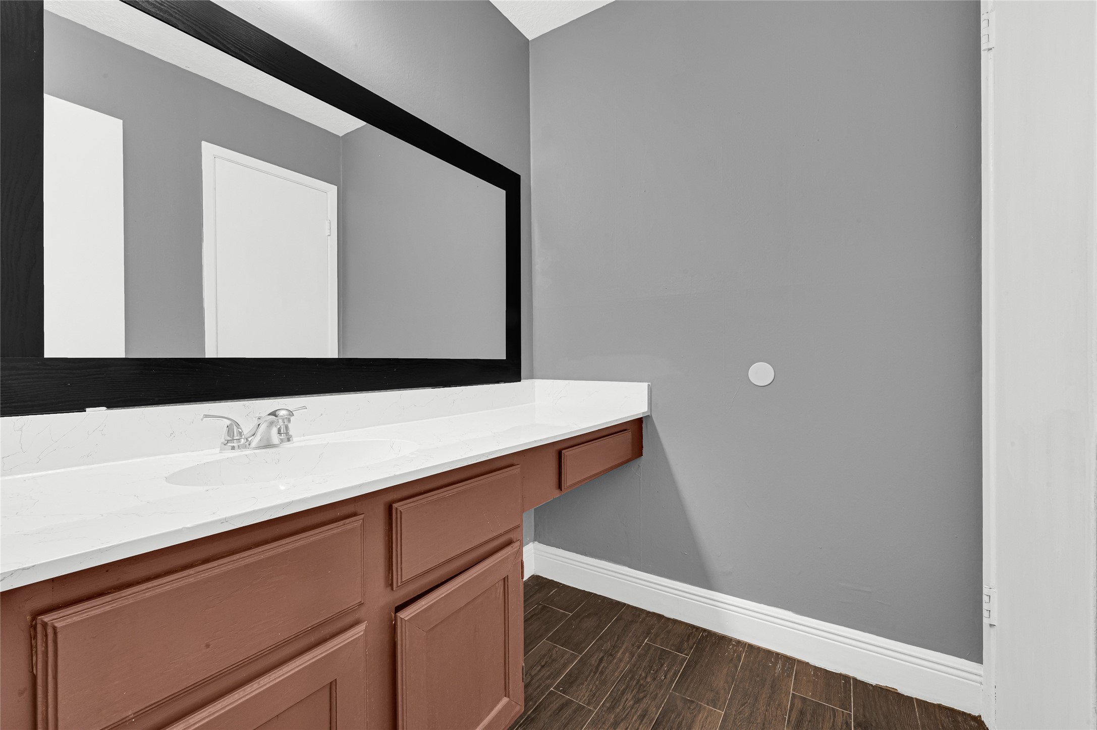 4170 Amir Street Houston, TX 77072 - Photo 13 of 18 a bathroom with a sink and a mirror