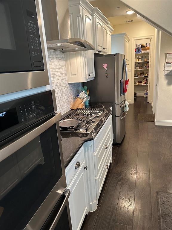 1037 Drew Lane Allen, TX 75013 - Photo 10 of 18 a kitchen with stainless steel appliances granite countertop a stove a sink and a refrigerator