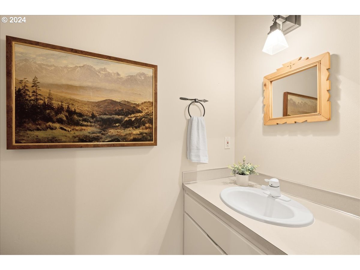 18650 South Lyons Road Oregon City, OR 97045 - Photo 21 of 47 a bathroom with a sink and a mirror