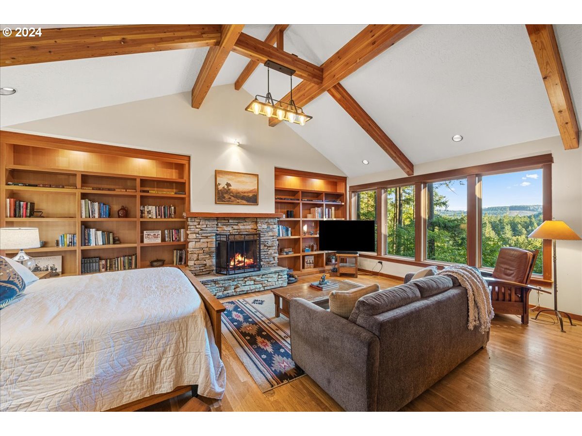 18650 South Lyons Road Oregon City, OR 97045 - Photo 24 of 47 a living room with fireplace furniture and a large window