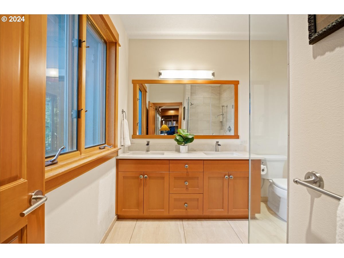 18650 South Lyons Road Oregon City, OR 97045 - Photo 28 of 47 a bathroom with a sink and a mirror