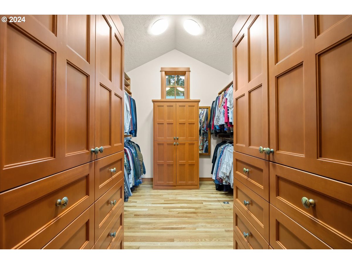 18650 South Lyons Road Oregon City, OR 97045 - Photo 31 of 47 a view of walk in closet with clothes and shoes