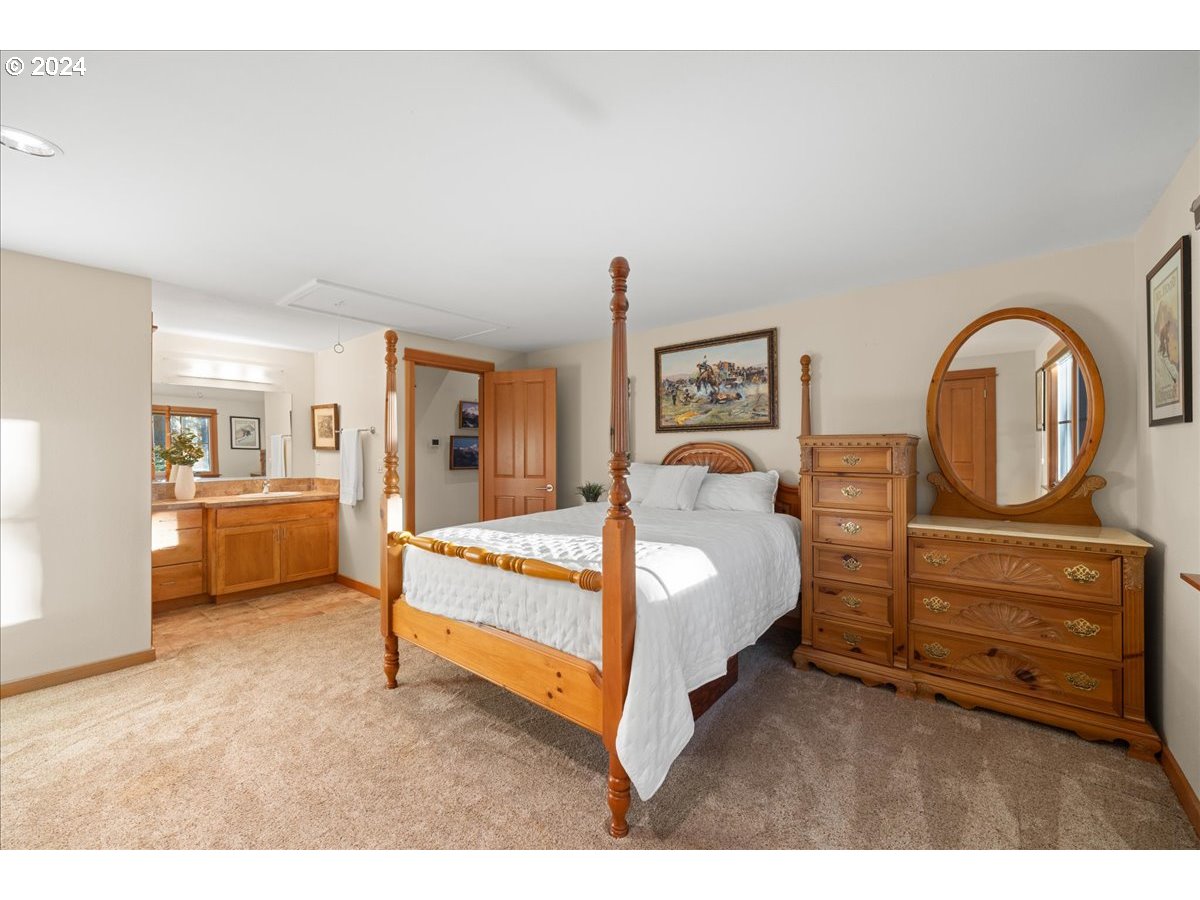 18650 South Lyons Road Oregon City, OR 97045 - Photo 34 of 47 a bed room with a bed and a view