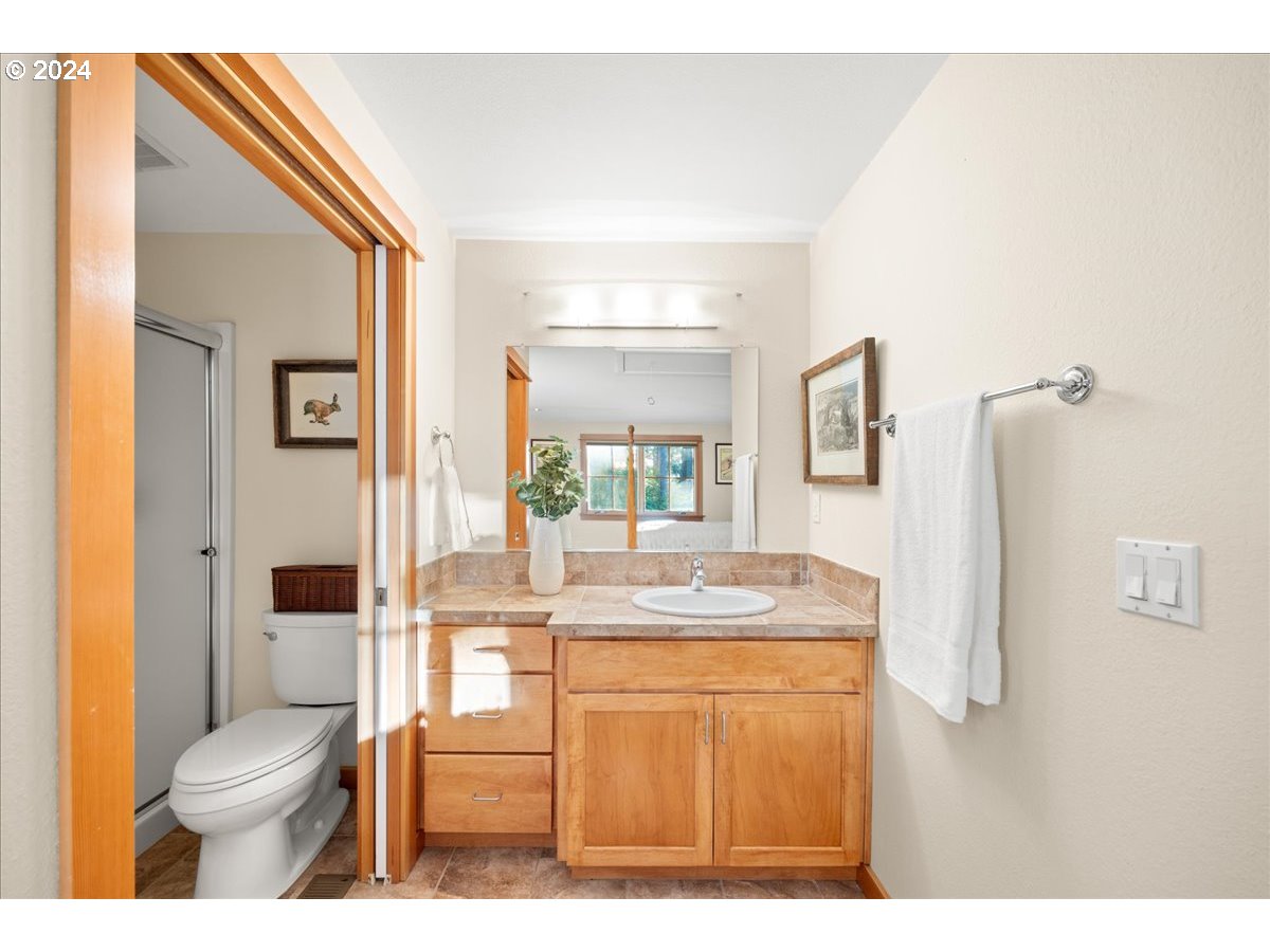 18650 South Lyons Road Oregon City, OR 97045 - Photo 35 of 47 a bathroom with a sink toilet and shower